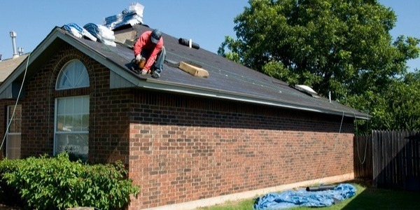 FEMA image of roofing replacement worker on home roof-2-1-1