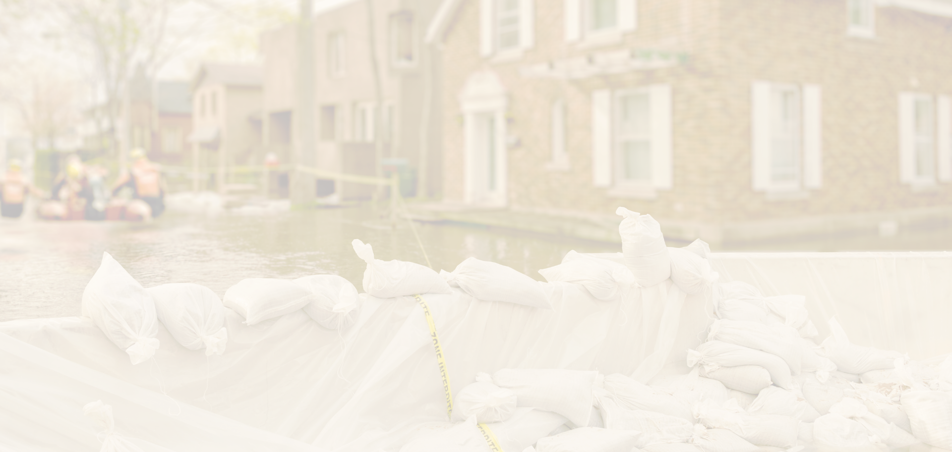 Brick home flooded street with sand bags