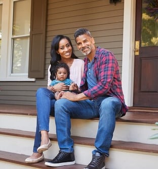 Happy african american couple on porch with baby-1