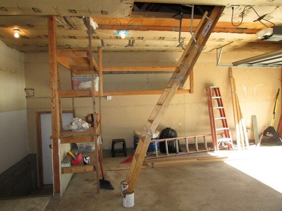 garage with too short ladder into storage space-1