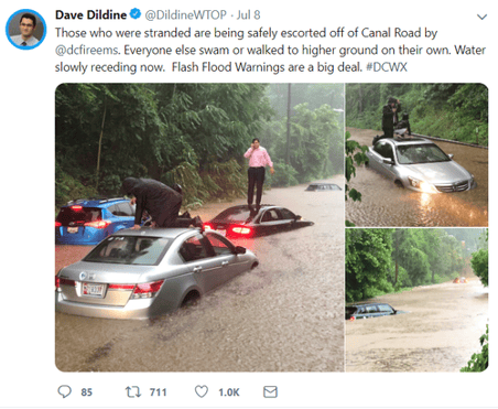 twitter post by Dave Dildine showing flash flooded road and people standing on cars-1