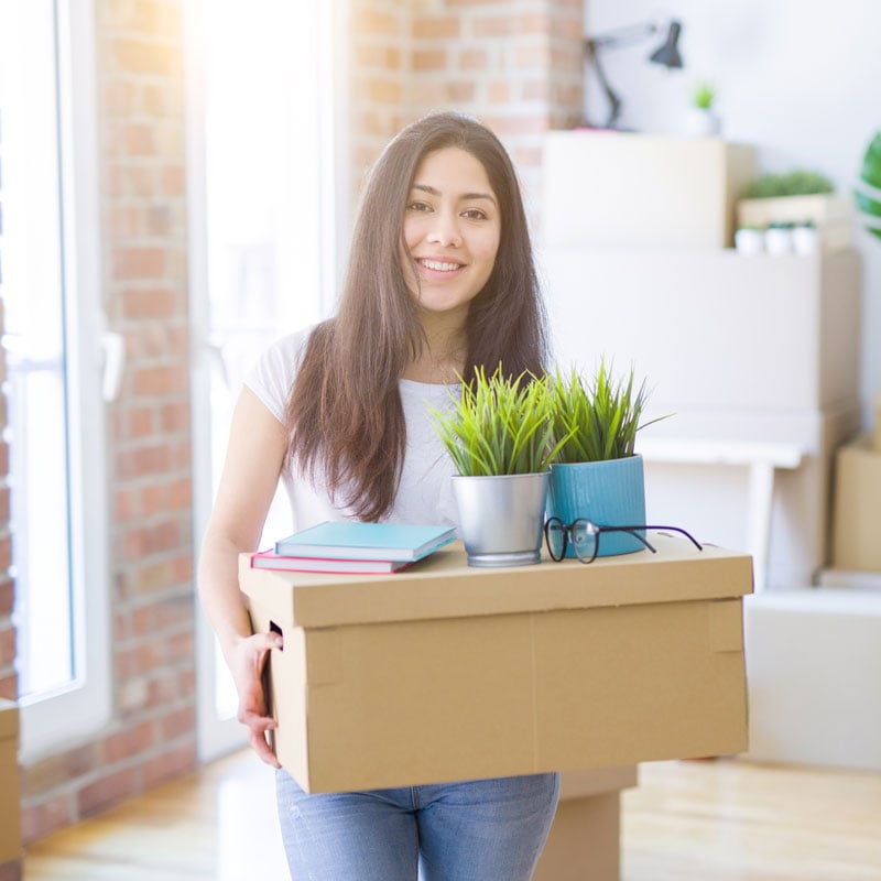 young lady moving into an apartment